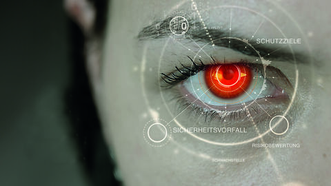 Header-Motiv IT-Sicherheit mit einem rot gefärbten Auge in Großaufnahme und Illustration zumThema