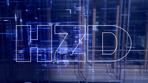 Das Logo der HZD vor hell erleuchtetem blauem Hintergrund