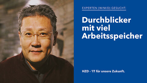 Porträt eines sympathisch aussehenden IT-Experten mit kurzen grauen Haaren und randloser Brille